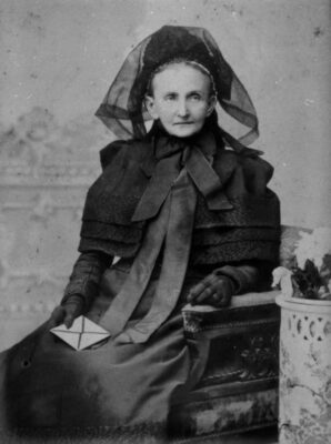 Elderly Woman in Mourning Clothes c1890 Wikimedia Commons